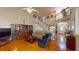 Spacious living room features hardwood floors, vaulted ceiling, and staircase to the upper level at 103 Haleswood Cir, Goose Creek, SC 29445