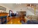 Cozy living room with hardwood floors, a fireplace, and a comfortable sofa at 103 Haleswood Cir, Goose Creek, SC 29445