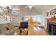 Open-concept living room showcases hardwood floors, a fireplace, and staircase to the second floor at 103 Haleswood Cir, Goose Creek, SC 29445