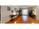 Well-lit living room featuring hardwood floors and elegant furnishings with a sophisticated atmosphere at 103 Haleswood Cir, Goose Creek, SC 29445