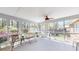 Bright and airy screened porch with outdoor seating and a view of the backyard at 103 Haleswood Cir, Goose Creek, SC 29445