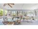 Relaxing screened-in porch featuring a ceiling fan and comfortable seating at 103 Haleswood Cir, Goose Creek, SC 29445