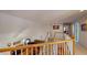 Bright upper staircase with views of the downstairs living area with a ceiling fan and hardwood floors at 103 Haleswood Cir, Goose Creek, SC 29445