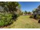 Private backyard showcasing lush greenery and a charming fence at 104 Abrum Ct, Goose Creek, SC 29445