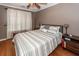 Bedroom with hardwood floors, queen bed, modern decor and natural light at 104 Abrum Ct, Goose Creek, SC 29445