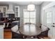 Charming breakfast nook features a round wood table with four wicker chairs, and views of the kitchen at 104 Abrum Ct, Goose Creek, SC 29445