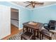 Dining room featuring a chess set, ceiling fan, hardwood floor, and an entrance to the hallway at 104 Abrum Ct, Goose Creek, SC 29445