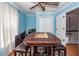Dining room with a chess set, a ceiling fan, a small bar, and an entrance to the hallway at 104 Abrum Ct, Goose Creek, SC 29445