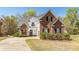 Charming two-story brick home with well-maintained landscaping and a welcoming front porch at 104 Abrum Ct, Goose Creek, SC 29445