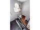 Bright foyer featuring hardwood floors, chandelier, and stairs with dark wood and white spindles at 104 Abrum Ct, Goose Creek, SC 29445