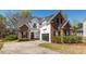 Beautiful brick and siding home with manicured landscaping and an attached garage at 104 Abrum Ct, Goose Creek, SC 29445