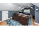 Spacious home theater with a large projector screen and comfortable leather seating at 104 Abrum Ct, Goose Creek, SC 29445