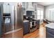 Modern kitchen with stainless steel appliances, gray cabinets, and granite countertops at 104 Abrum Ct, Goose Creek, SC 29445