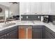 Modern kitchen with marble countertops, stainless steel appliances, and gray cabinetry at 104 Abrum Ct, Goose Creek, SC 29445