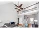 Bright living room with high ceilings, ceiling fan, staircase, and comfortable seating area at 104 Abrum Ct, Goose Creek, SC 29445