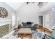 Cozy living room features vaulted ceiling, fireplace, sofa, and staircase to the second floor at 104 Abrum Ct, Goose Creek, SC 29445