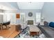 Cozy living room with fireplace, comfortable seating, and natural light from shuttered windows at 104 Abrum Ct, Goose Creek, SC 29445