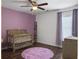Bedroom with hardwood floors and a purple accent wall at 104 Salem Rd, Ladson, SC 29456