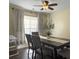 Cozy dining room with a modern ceiling fan and ample natural light from the large window at 104 Salem Rd, Ladson, SC 29456