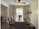 Bright dining area with a dark wood table, neutral walls, and a large window providing ample natural light at 104 Salem Rd, Ladson, SC 29456