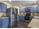 Modern kitchen with stainless steel appliances, custom cabinets, and hardwood floors at 104 Salem Rd, Ladson, SC 29456