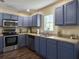 Stylish kitchen with stainless steel appliances, custom cabinets, and a view of the backyard at 104 Salem Rd, Ladson, SC 29456