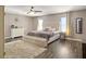 Spacious primary bedroom with hardwood floors and two windows allowing natural light at 104 Salem Rd, Ladson, SC 29456