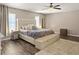 Relaxing main bedroom featuring a king-sized bed, soft lighting, and a plush rug at 104 Salem Rd, Ladson, SC 29456
