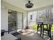 Cozy screened-in porch with outdoor seating and a view of the backyard at 104 Salem Rd, Ladson, SC 29456