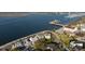Stunning aerial view of coastal homes on the waterfront with a bridge and harbor in the background at 106 Murray Blvd, Charleston, SC 29401