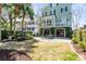 Secluded backyard with patio and lush lawn offers a perfect outdoor retreat at 106 Murray Blvd, Charleston, SC 29401