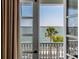Scenic view from a balcony, showcasing beautiful ocean and palm trees at 106 Murray Blvd, Charleston, SC 29401