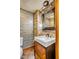 Charming bathroom with modern sink, decorative tile backsplash, and attractive light fixture at 106 Murray Blvd, Charleston, SC 29401