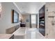 A spacious bathroom features a soaking tub, a walk-in shower, and gray walls at 106 Murray Blvd, Charleston, SC 29401