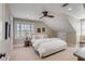 A carpeted bedroom featuring neutral walls, a cozy bed, and a ceiling fan at 106 Murray Blvd, Charleston, SC 29401