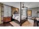 A bedroom features a four-poster bed, curtains, and a window with shutters at 106 Murray Blvd, Charleston, SC 29401