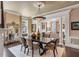 Elegant dining room featuring a large table, stylish decor, and ample natural light at 106 Murray Blvd, Charleston, SC 29401