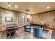 Game room with brick walls, foosball table, desk, and leather chairs at 106 Murray Blvd, Charleston, SC 29401