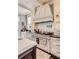 Chef's kitchen featuring a professional range, custom hood, and stylish cabinetry at 106 Murray Blvd, Charleston, SC 29401