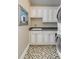 A laundry room features cabinets, a sink, and a washer and dryer at 106 Murray Blvd, Charleston, SC 29401