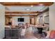 Large living room featuring wood beams, a TV, and brick wall details at 106 Murray Blvd, Charleston, SC 29401