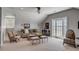 Bright and airy living room with balcony access, plush seating, and a scenic view at 106 Murray Blvd, Charleston, SC 29401