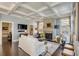 Bright living room features a fireplace, large windows, and comfortable seating arrangements at 106 Murray Blvd, Charleston, SC 29401