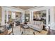 Open-concept living room with hardwood floors, neutral palette, and elegant furnishings at 106 Murray Blvd, Charleston, SC 29401