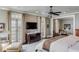 Main bedroom boasts natural light, TV, and access to balcony overlooking the water at 106 Murray Blvd, Charleston, SC 29401