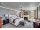 Bright main bedroom featuring a fireplace, seating area, and a luxurious king-size bed at 106 Murray Blvd, Charleston, SC 29401