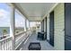 A porch offers outdoor seating and a great view of the harbor at 106 Murray Blvd, Charleston, SC 29401