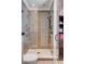 Modern bathroom featuring a glass enclosed shower with beautiful tile design and bronze fixtures at 106 Murray Blvd, Charleston, SC 29401