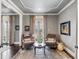 Bedroom seating area with decorative art, cozy chairs, and scenic outdoor view at 106 Murray Blvd, Charleston, SC 29401