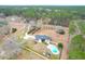 Expansive aerial view showcasing the home, large lot, swimming pool, and mature trees at 1158 Wildgame Rd, Summerville, SC 29486